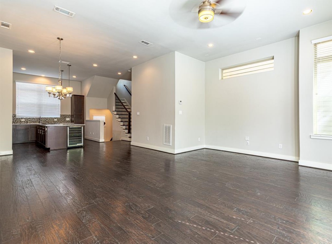 1441 Wagner Street Houston, TX 77007 - Photo 11 of 19 an open kitchen with a refrigerator and a stove top oven