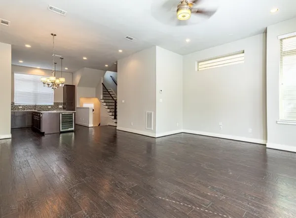 a view of a kitchen with a refrigerator and a stove