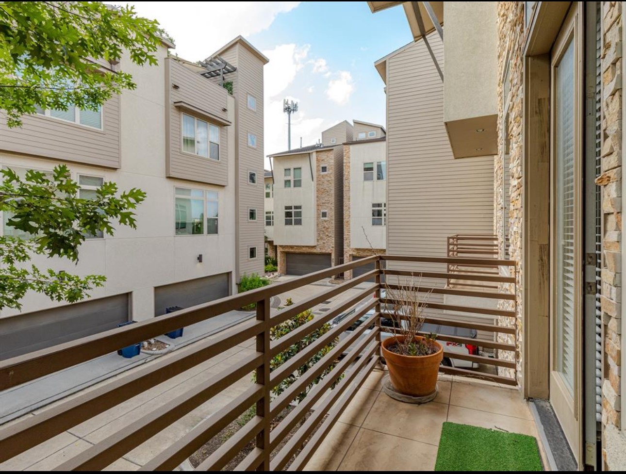 1441 Wagner Street Houston, TX 77007 - Photo 5 of 19 a view of balcony with chairs and wooden fence