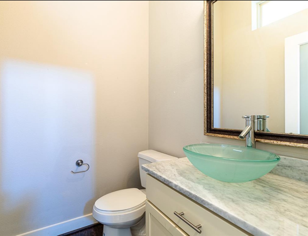 1441 Wagner Street Houston, TX 77007 - Photo 10 of 19 a bathroom with a granite countertop toilet and a sink