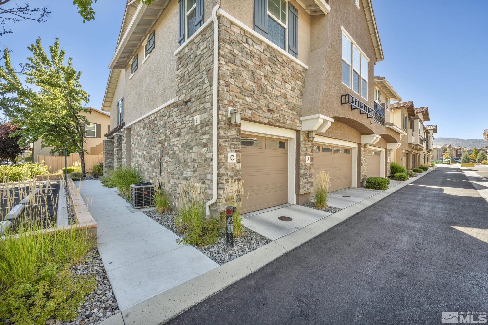 1924 Wind Ranch Road, Unit C Reno, NV 89521 - Photo 1 of 27 a view of a large building with a street