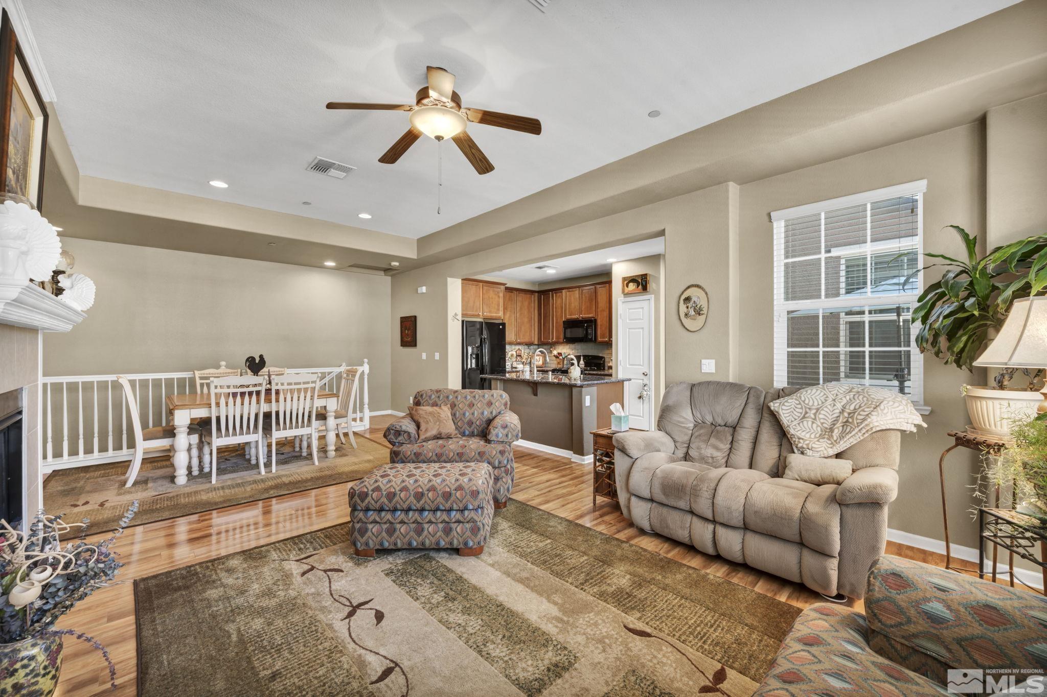1924 Wind Ranch Road, Unit C Reno, NV 89521 - Photo 12 of 27 a living room with furniture and a large window