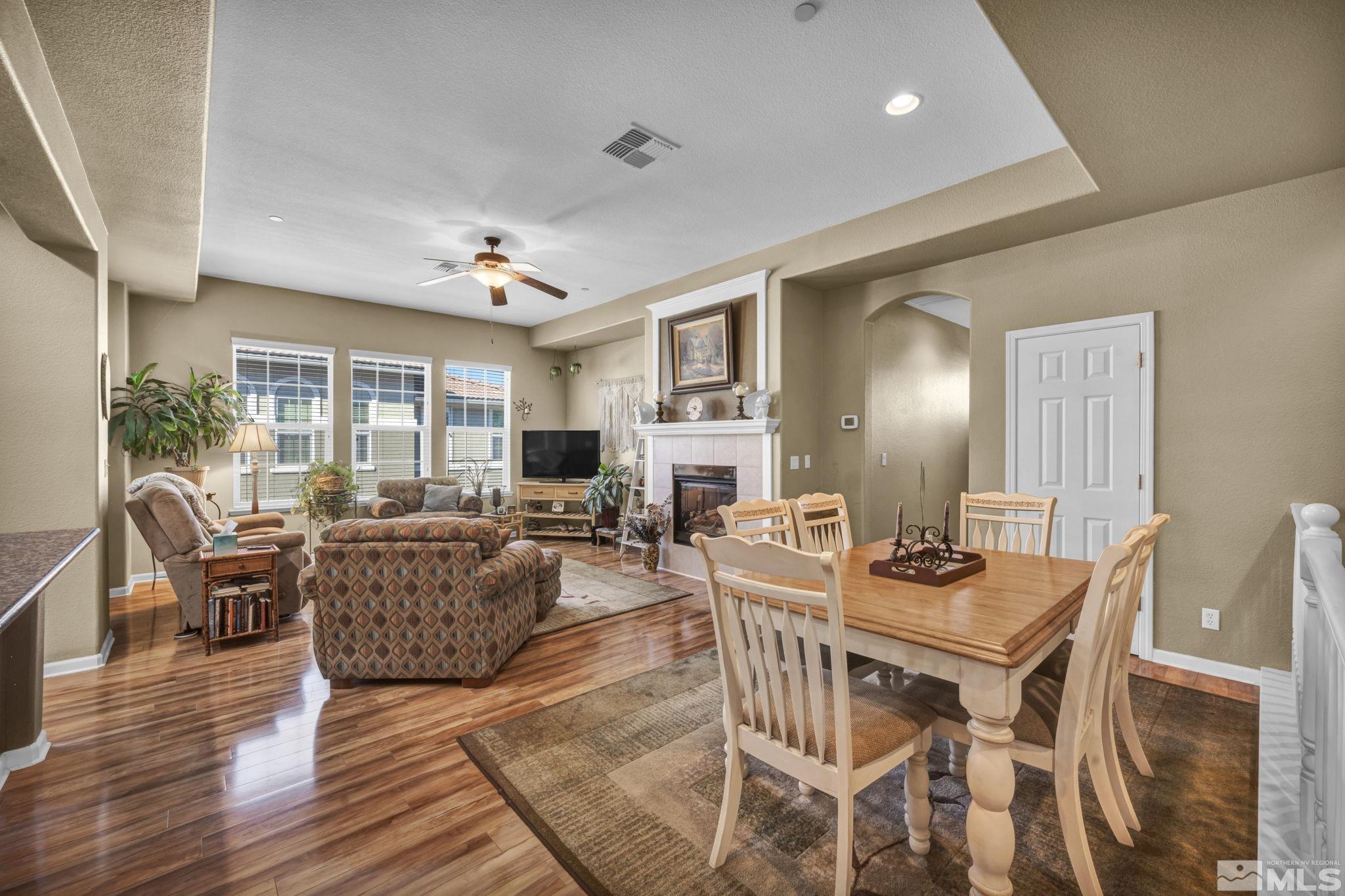 1924 Wind Ranch Road, Unit C Reno, NV 89521 - Photo 6 of 27 a view of a dining room with furniture window and wooden floor
