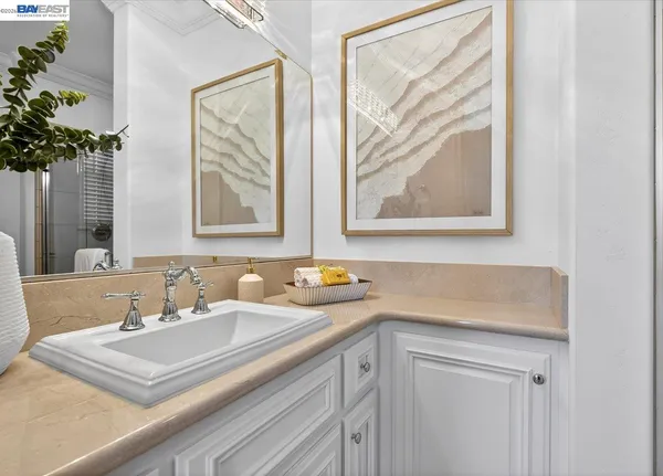 a kitchen with white cabinets