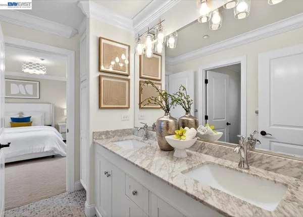 a bathroom with a granite countertop sink a toilet a mirror and shower