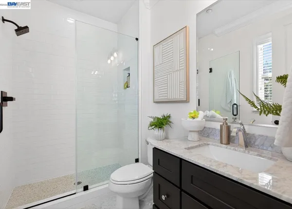 a spacious bedroom with a bed and a window