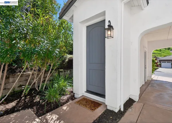 a view of a big yard with a house in the background