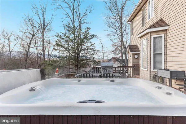 a view of empty room with wooden floor and chair