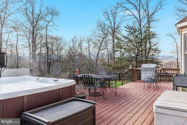 a view of a dining room with furniture and a potted plant