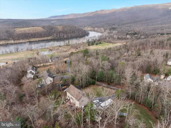 a view of a house with swimming pool and sitting area