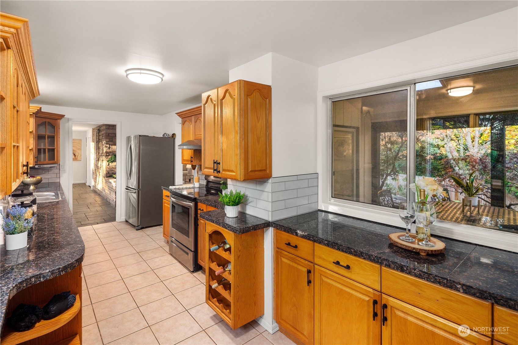 11030 Circle Drive Bothell, WA 98011 - Photo 11 of 38 a spacious bathroom with a double vanity sink and a mirror