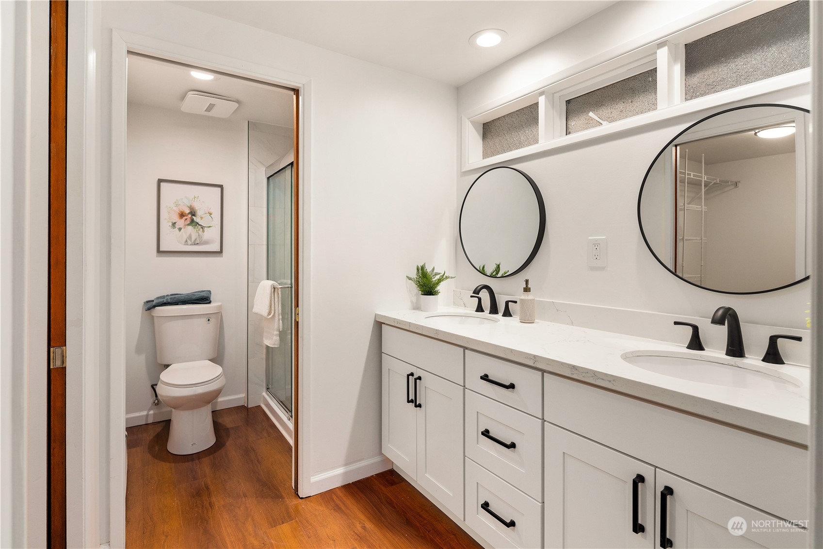 11030 Circle Drive Bothell, WA 98011 - Photo 17 of 38 a bathroom with a toilet a sink and a mirror
