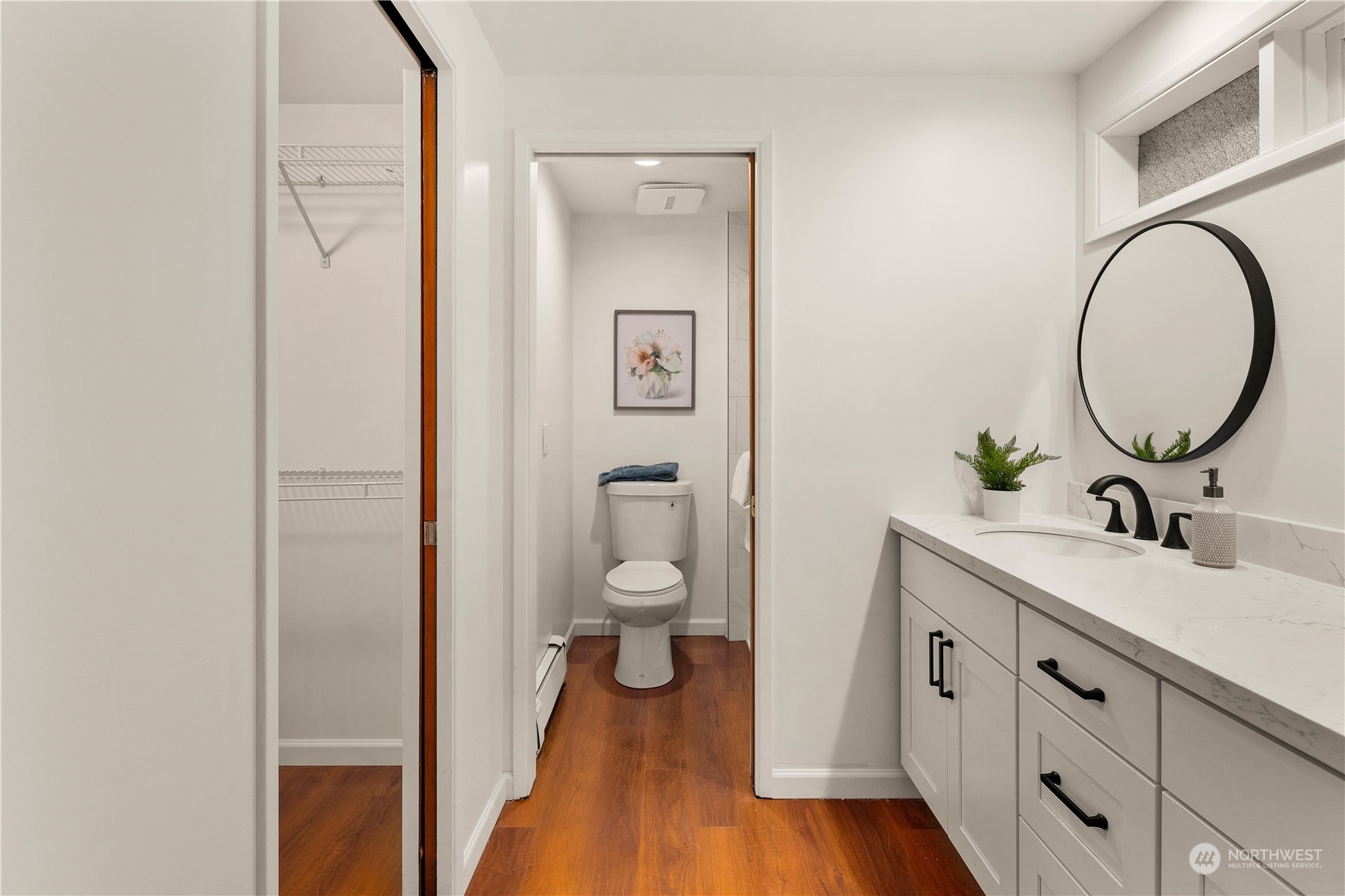 11030 Circle Drive Bothell, WA 98011 - Photo 18 of 38 a bathroom with a toilet a sink and a mirror