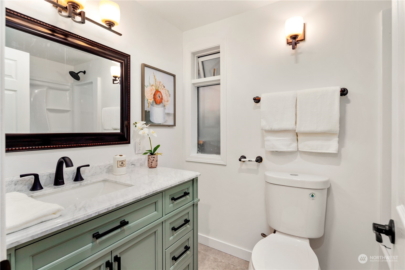 11030 Circle Drive Bothell, WA 98011 - Photo 22 of 38 a bathroom with a toilet sink and mirror