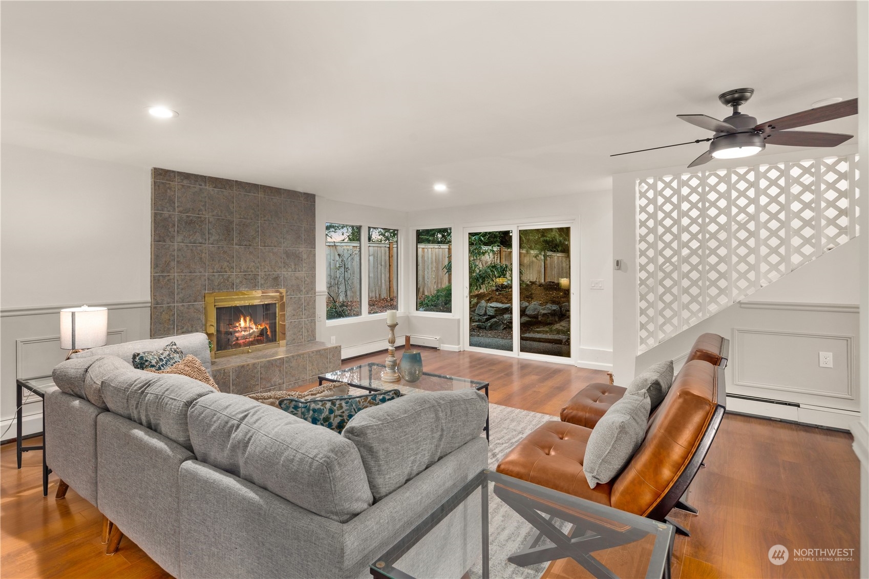11030 Circle Drive Bothell, WA 98011 - Photo 24 of 38 a living room with furniture and a fireplace
