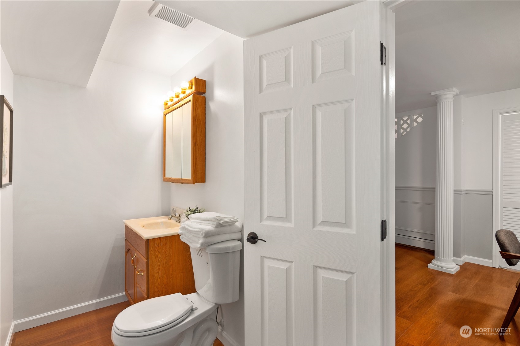 11030 Circle Drive Bothell, WA 98011 - Photo 26 of 38 a white toilet sitting next to a bathroom sink