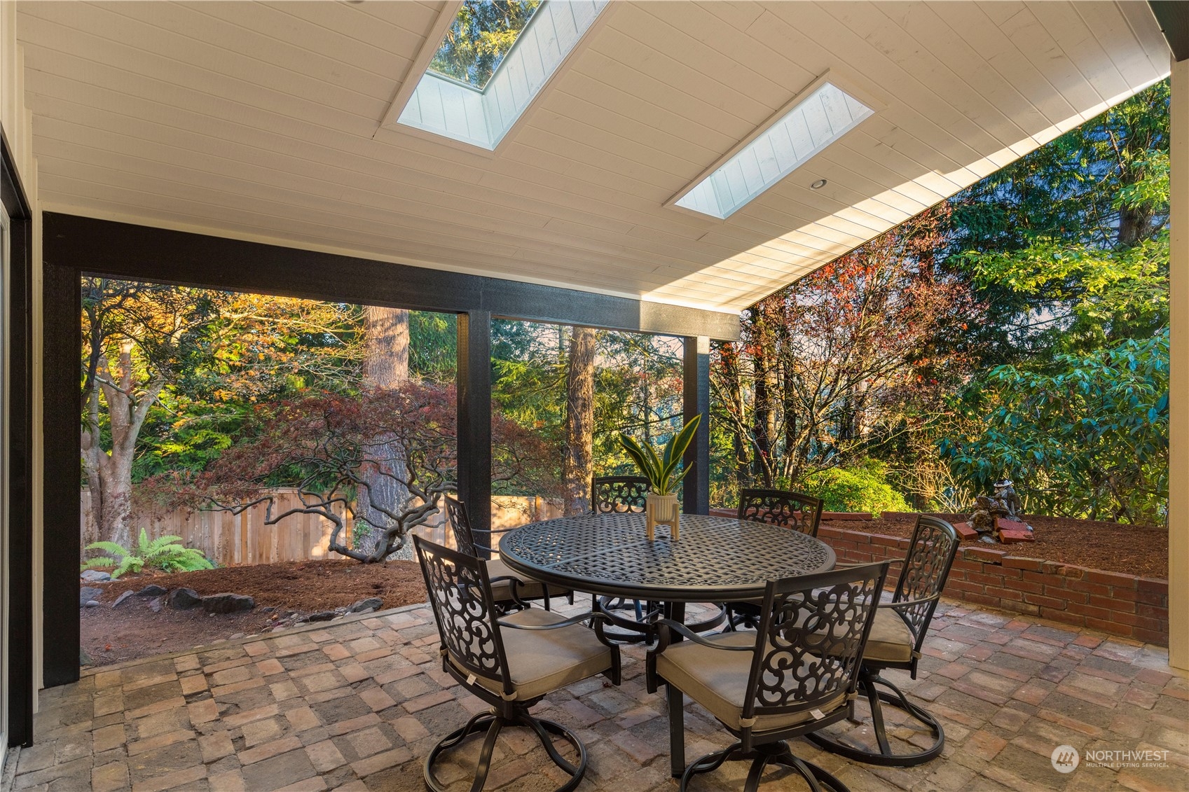 11030 Circle Drive Bothell, WA 98011 - Photo 27 of 38 a view of a dining room with furniture window and outside view