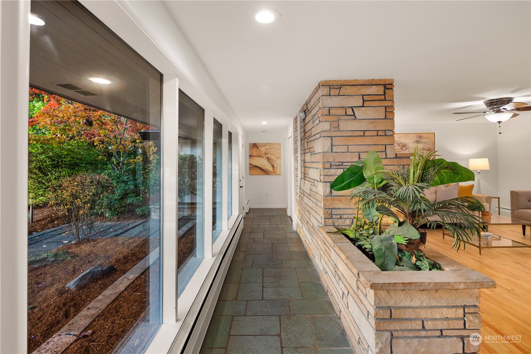 11030 Circle Drive Bothell, WA 98011 - Photo 5 of 38 a view of a balcony with wooden floor