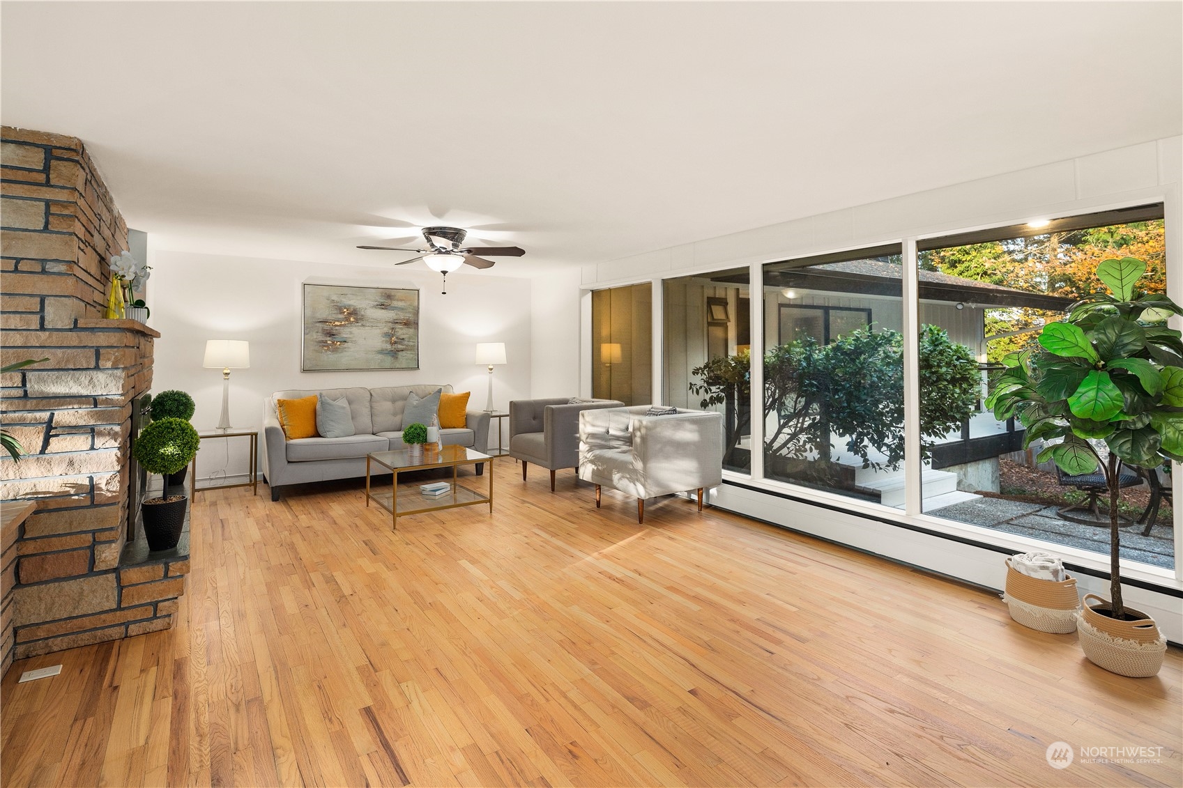 11030 Circle Drive Bothell, WA 98011 - Photo 7 of 38 a living room with furniture and a large window