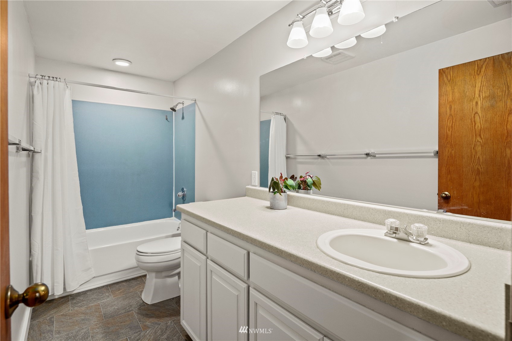 22613 Meridian Avenue South Bothell, WA 98021 - Photo 18 of 39 a bathroom with a sink a toilet and shower