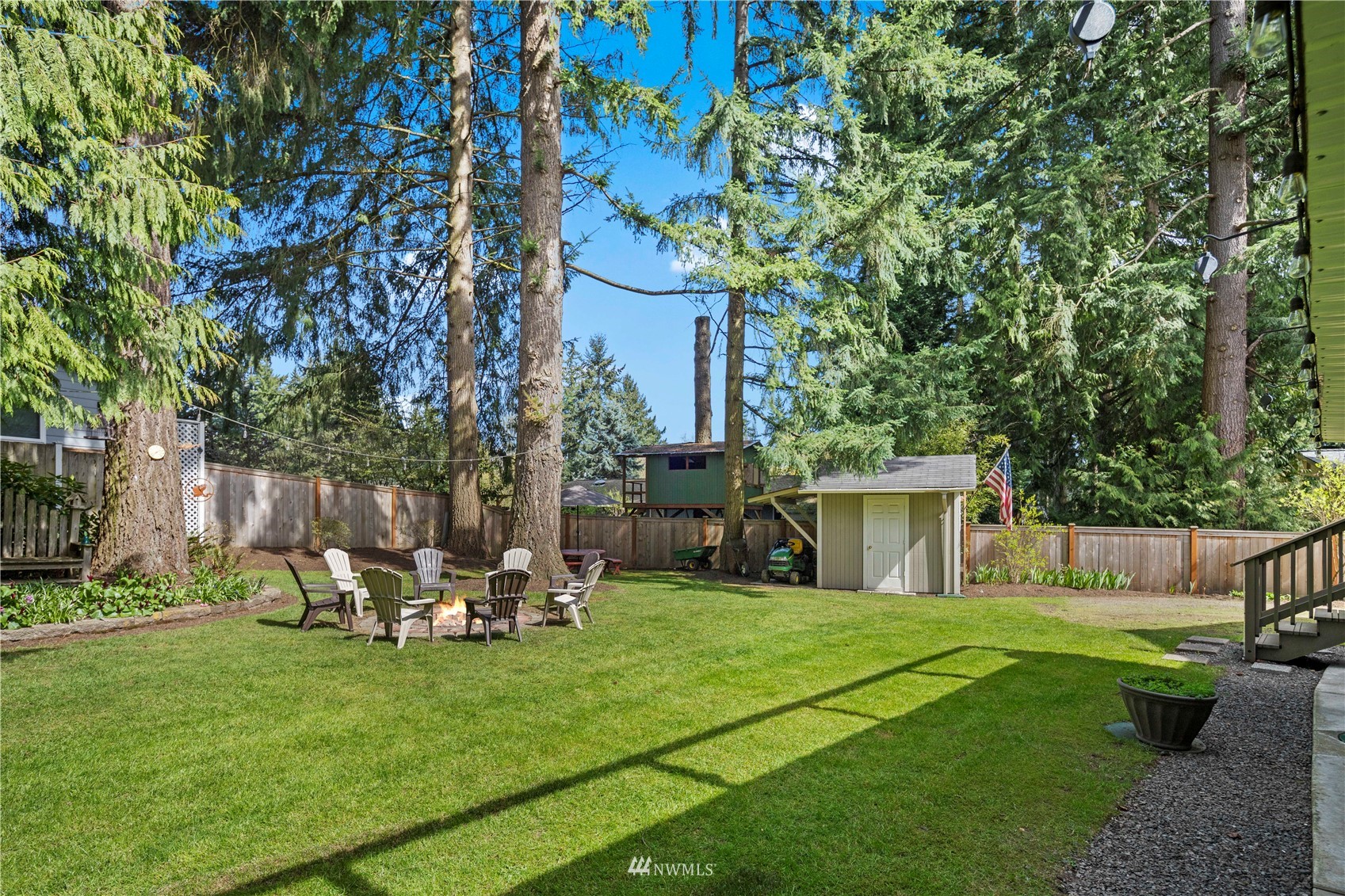 22613 Meridian Avenue South Bothell, WA 98021 - Photo 30 of 39 a view of a chair and table in backyard of the house