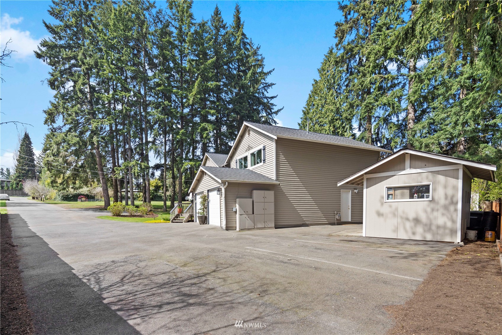 22613 Meridian Avenue South Bothell, WA 98021 - Photo 35 of 39 a front view of a house with a yard and garage