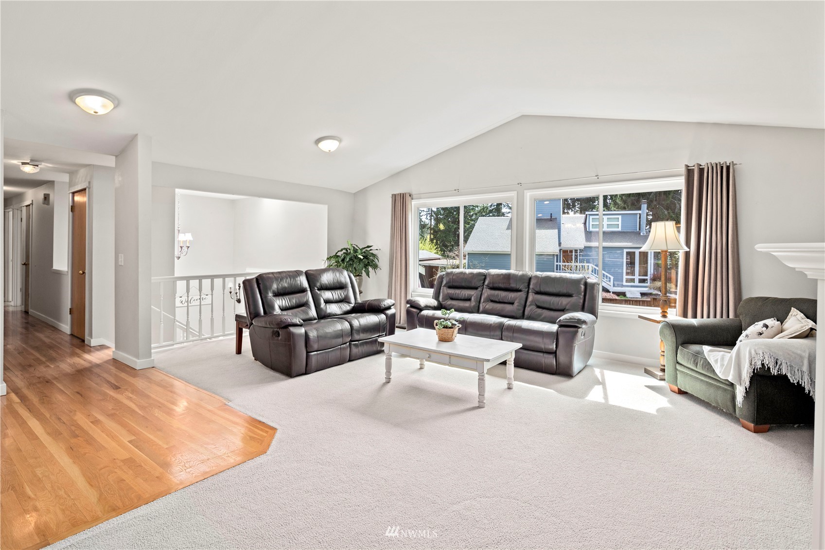 22613 Meridian Avenue South Bothell, WA 98021 - Photo 5 of 39 a living room with furniture and large windows