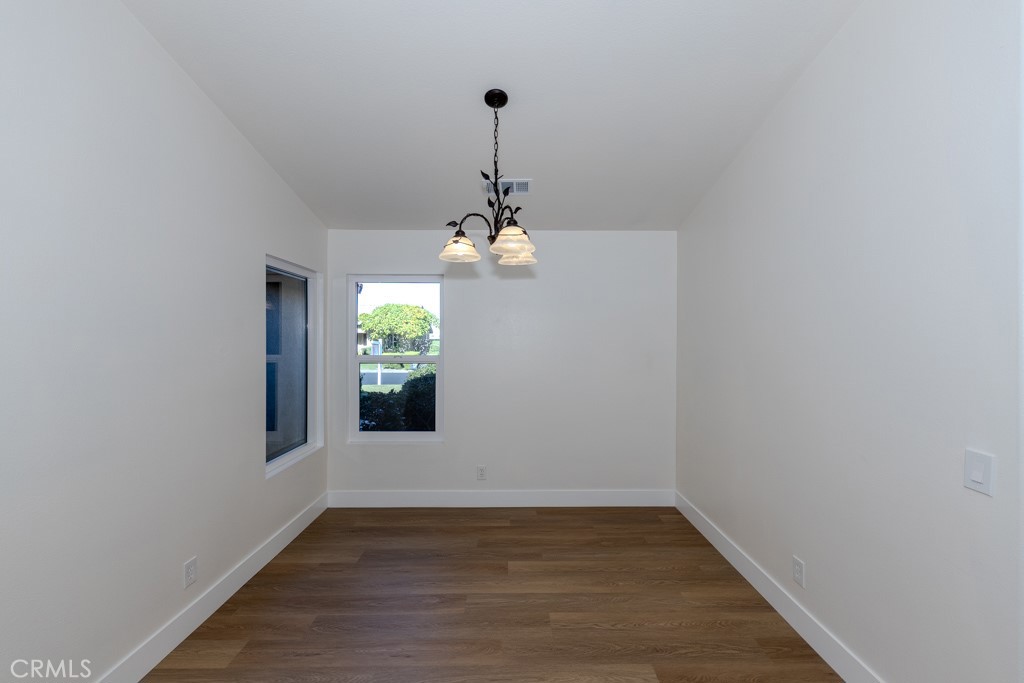 80675 Independence Avenue Indio, CA 92201 - Photo 13 of 72 a view of empty room with wooden floor and fan