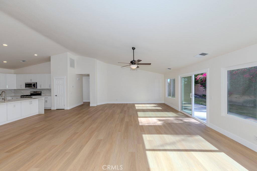 80675 Independence Avenue Indio, CA 92201 - Photo 19 of 72 a view of an empty room and kitchen view