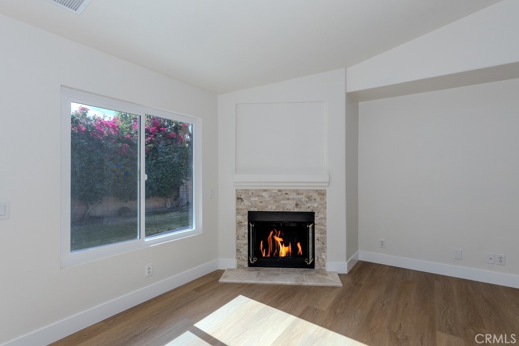 80675 Independence Avenue Indio, CA 92201 - Photo 26 of 72 a living room with a fireplace and a fireplace
