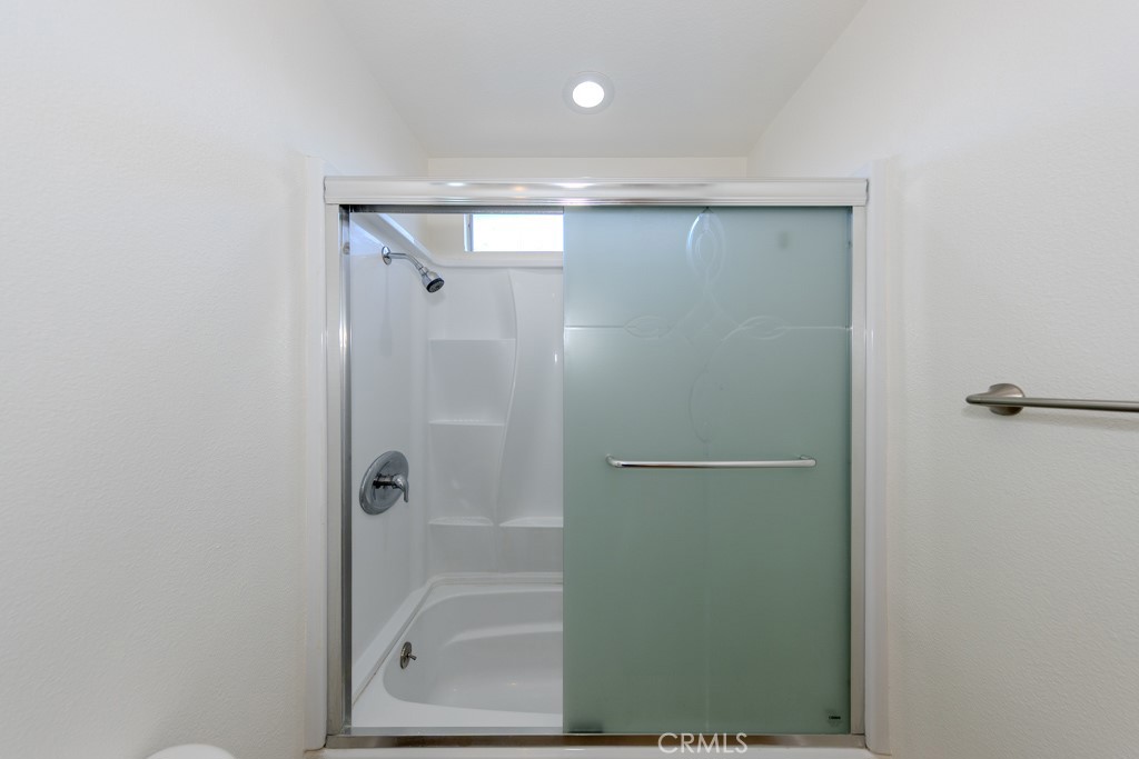 80675 Independence Avenue Indio, CA 92201 - Photo 41 of 72 a bathroom with a glass shower door