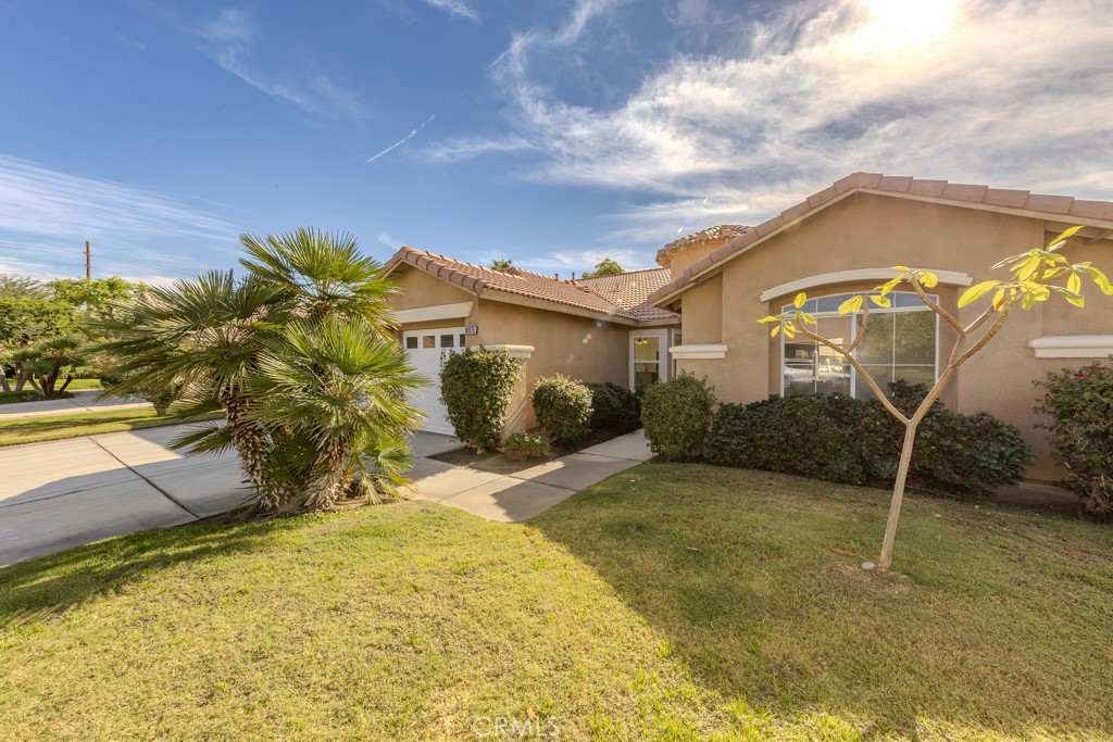 80675 Independence Avenue Indio, CA 92201 - Photo 62 of 72 a view of a house with a yard
