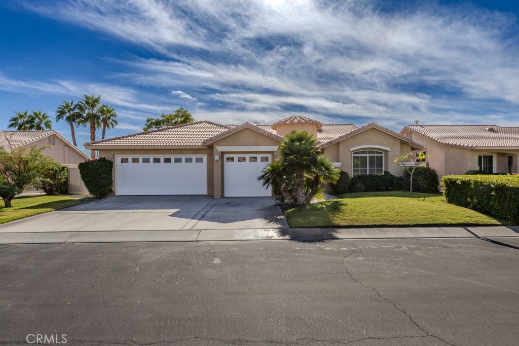 80675 Independence Avenue Indio, CA 92201 - Photo 70 of 72 a view of multiple house with a yard and potted plants