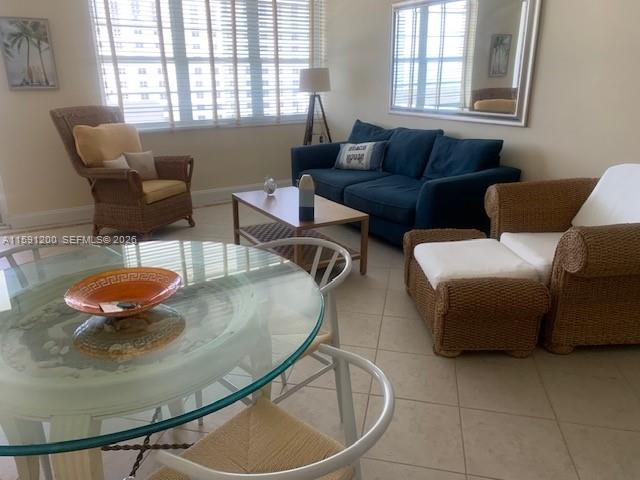 100 Lincoln Road, Unit 1434 Miami Beach, FL 33139 - Photo 4 of 29 a living room with furniture a table and a window