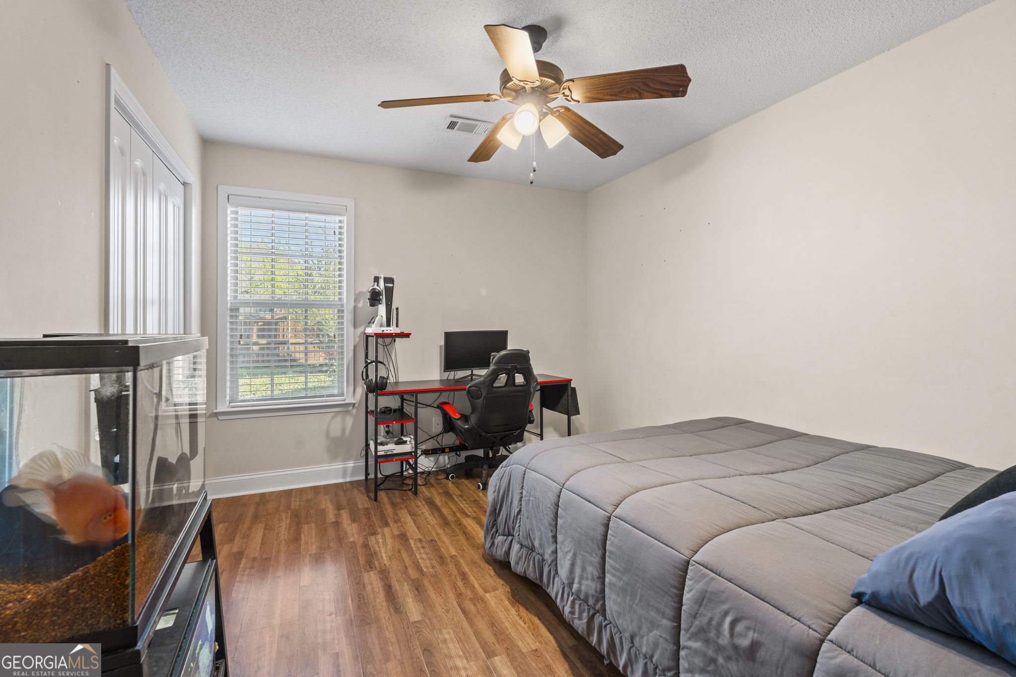 620 Amherst Street Kathleen, GA 31047 - Photo 19 of 31 a bed room with a bed and a chair