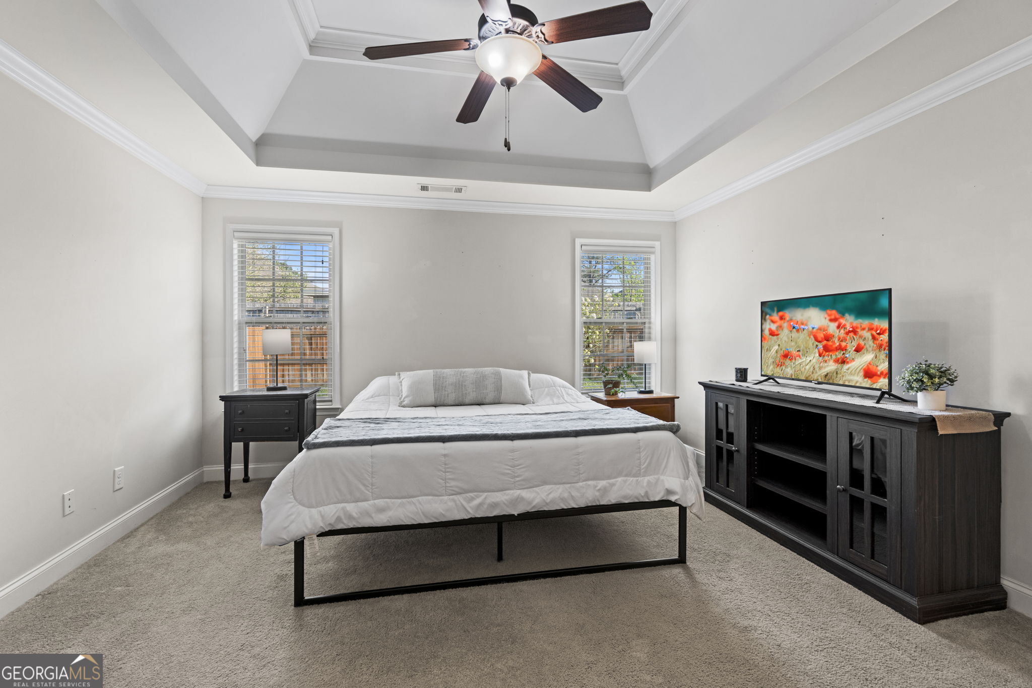 620 Amherst Street Kathleen, GA 31047 - Photo 21 of 31 a spacious bedroom with a bed and a flat screen tv