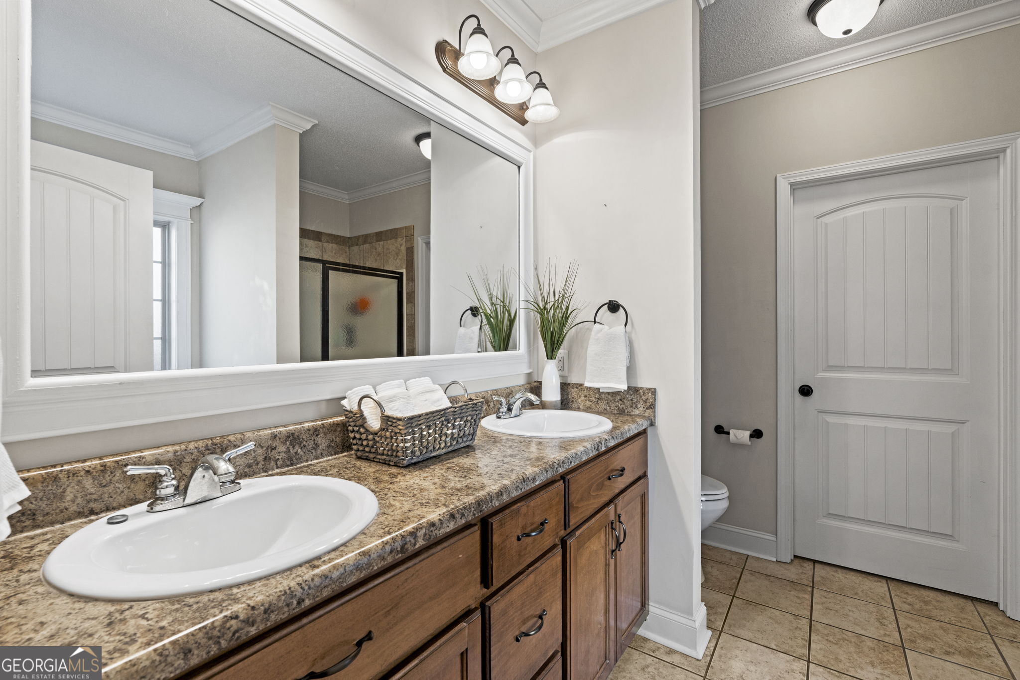 620 Amherst Street Kathleen, GA 31047 - Photo 24 of 31 a bathroom with a granite countertop sink and a mirror