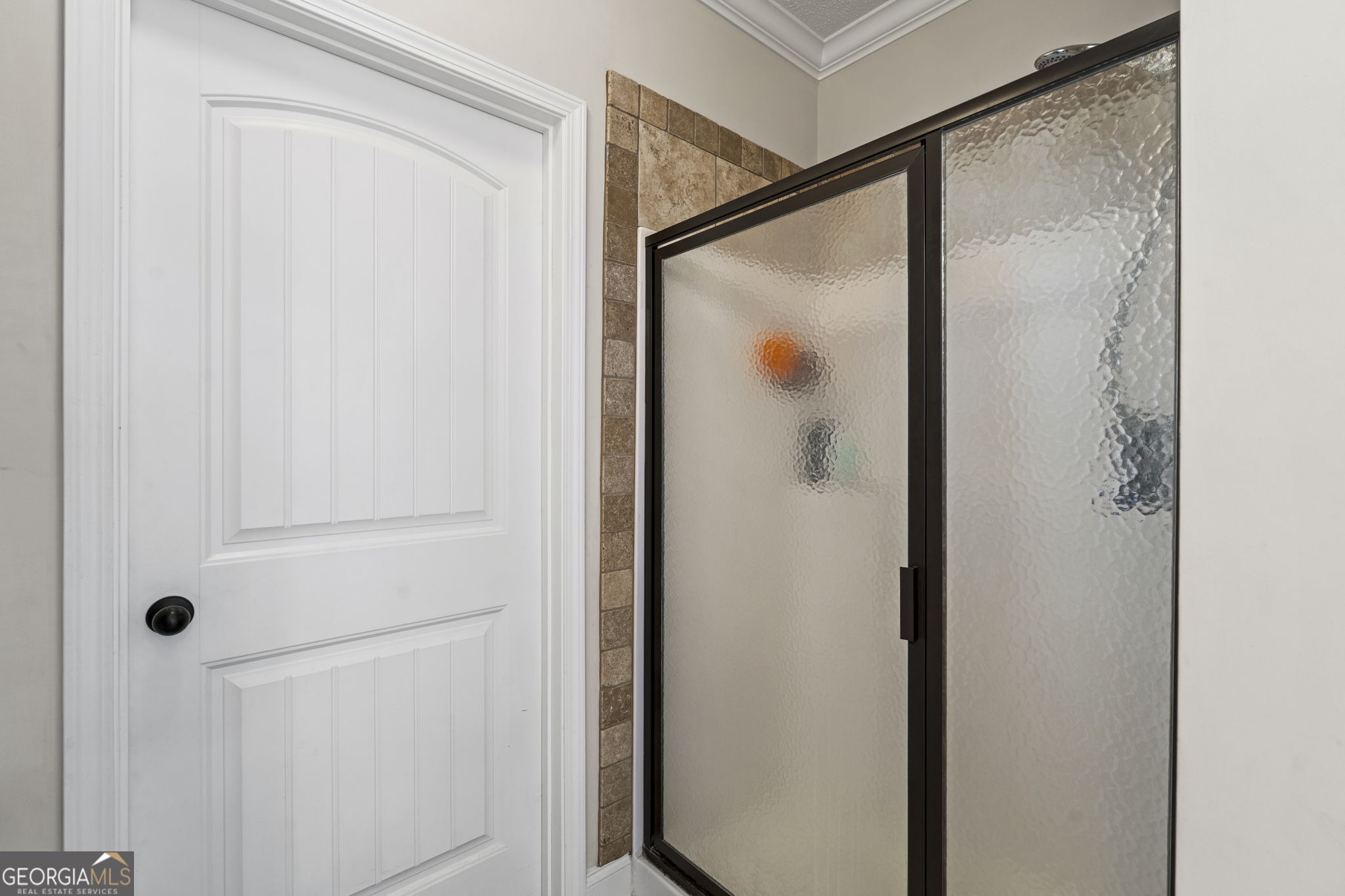 620 Amherst Street Kathleen, GA 31047 - Photo 25 of 31 a bathroom with a glass shower door