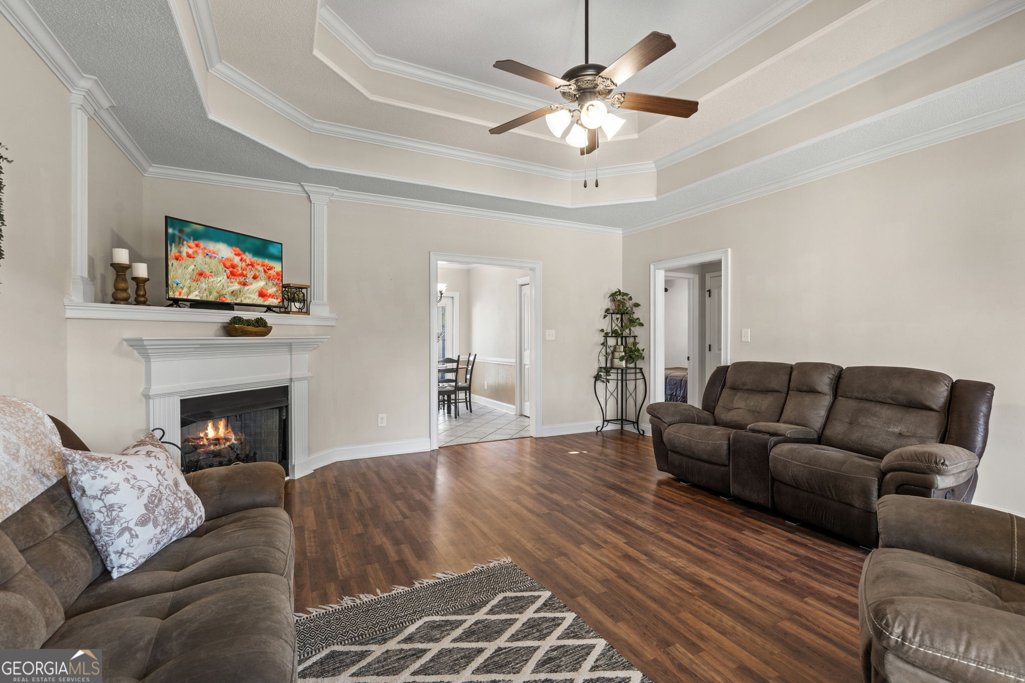 620 Amherst Street Kathleen, GA 31047 - Photo 7 of 31 a living room with furniture a fireplace and a flat screen tv