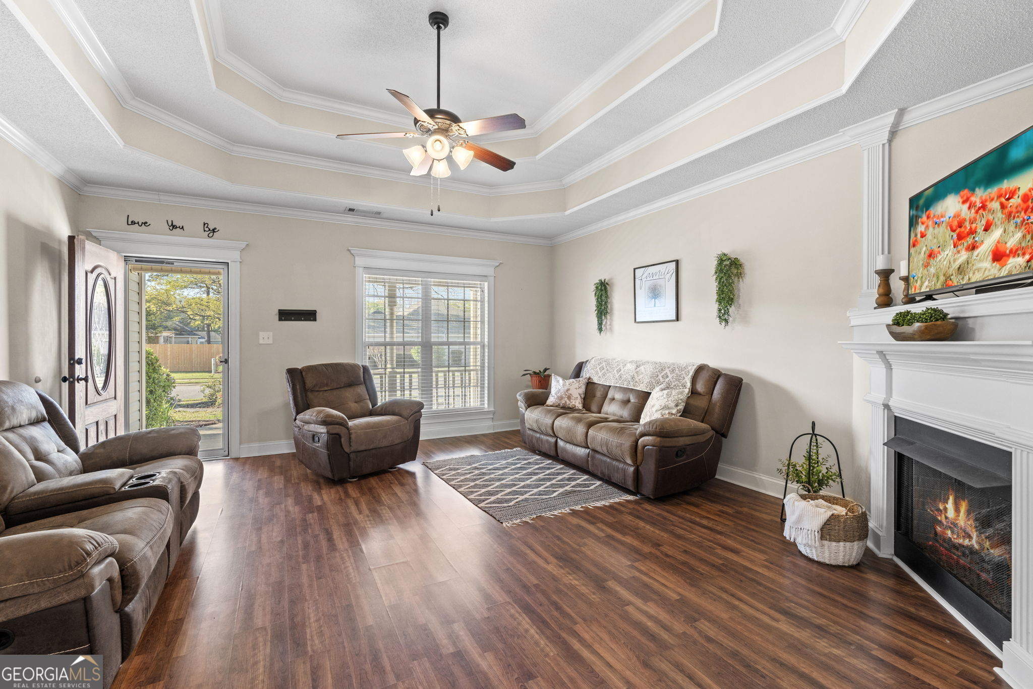620 Amherst Street Kathleen, GA 31047 - Photo 9 of 31 a living room with furniture a fireplace and a flat screen tv