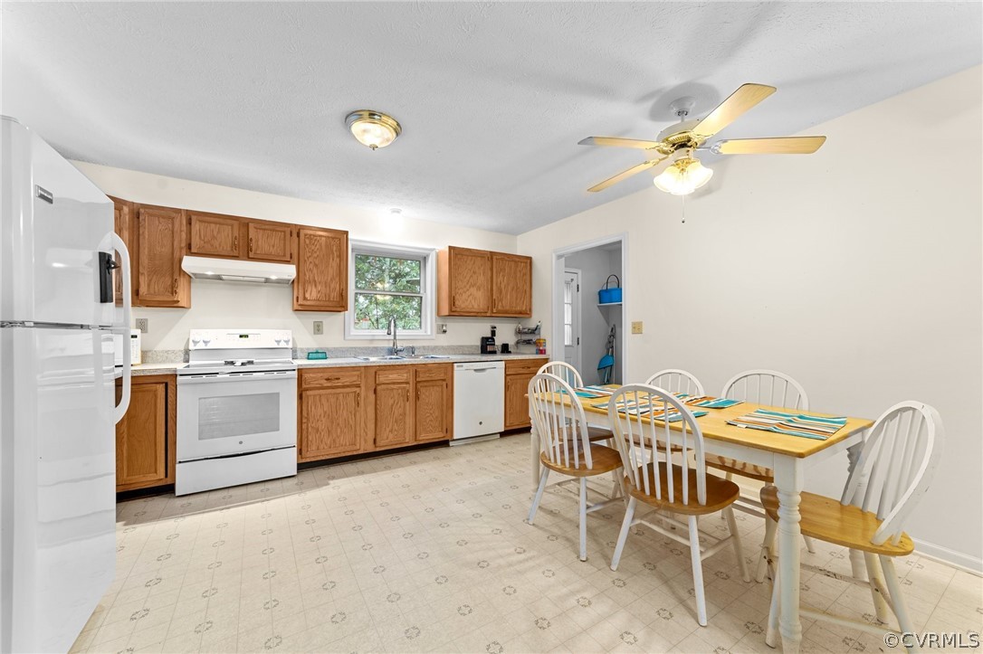 650 Johnson Road Mineral, VA 23117 - Photo 13 of 29 a kitchen with a table chairs and a sink
