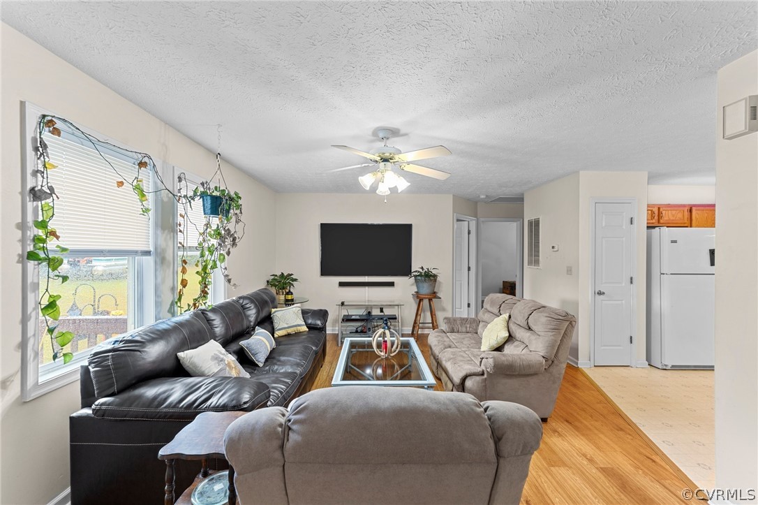 650 Johnson Road Mineral, VA 23117 - Photo 20 of 29 a living room with furniture and a flat screen tv