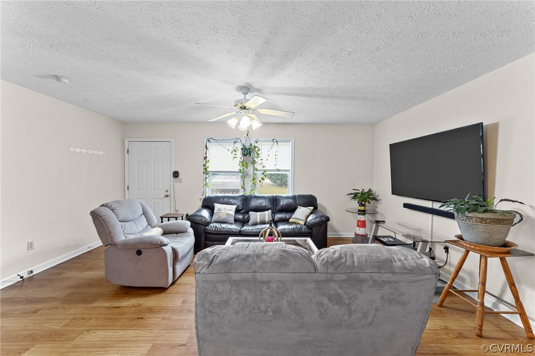 650 Johnson Road Mineral, VA 23117 - Photo 22 of 29 a living room with furniture and a flat screen tv