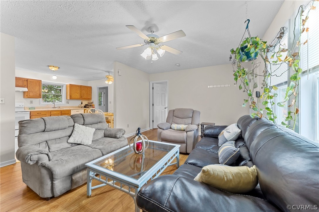 650 Johnson Road Mineral, VA 23117 - Photo 23 of 29 a living room with furniture and a chandelier