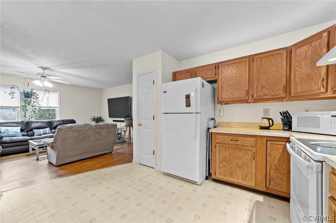 650 Johnson Road Mineral, VA 23117 - Photo 27 of 29 a kitchen with stainless steel appliances granite countertop a refrigerator and a stove top oven