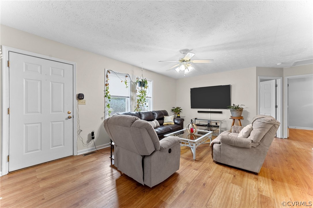 650 Johnson Road Mineral, VA 23117 - Photo 29 of 29 a living room with furniture and a flat screen tv