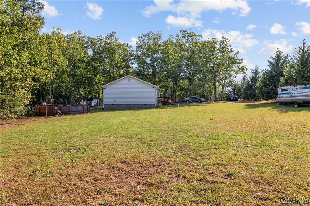 650 Johnson Road Mineral, VA 23117 - Photo 5 of 29 a view of a lake with a building in the background