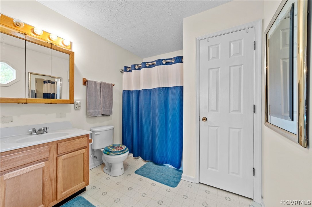 650 Johnson Road Mineral, VA 23117 - Photo 9 of 29 a bathroom with a sink mirror and toilet