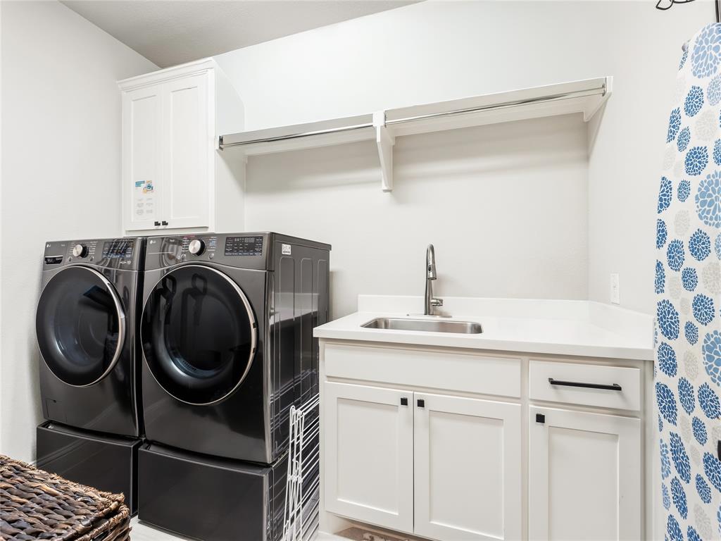 15340 Crape Myrtle Road Frisco, TX 75035 - Photo 25 of 40 Dedicated laundry space featuring a built-in sink with a gooseneck faucet, white shaker-style cabinetry with matte black hardware, and a white countertop