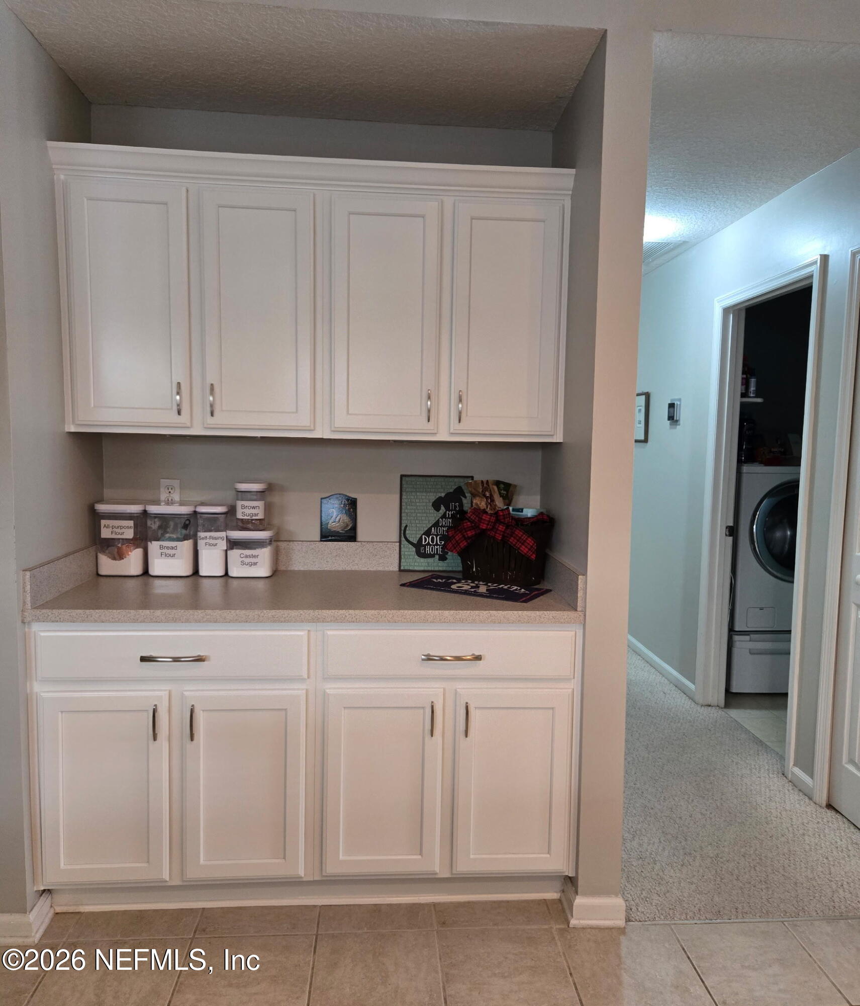 1424 Tintern Lane St. Augustine, FL 32092 - Photo 12 of 32 a kitchen with white cabinets